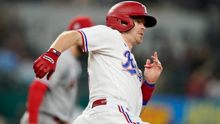 Former Texas Rangers' Brock Holt rounds first on his way to second with a two-run double in the eighth inning of a baseball game against the Los Angeles Angels. (Tony Gutierrez/AP)