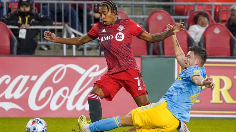 Toronto FC midfielder Jahkeele Marshall-Rutty  is tackled by Philadelphia Union defender Kai Wagner during second half MLS action. (Evan Buhler/CP)