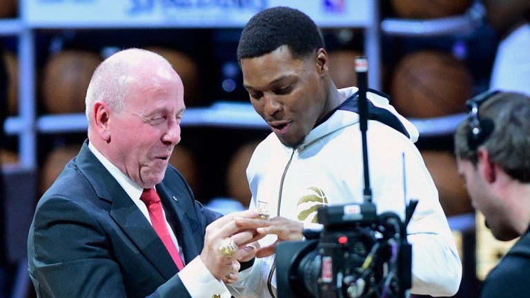 Toronto Raptors guard Kyle Lowry receives his 2019 NBA championship ring from Larry Tanenbaum, chairman of Maple Leaf Sports & Entertainment. (Frank Gunn/CP)