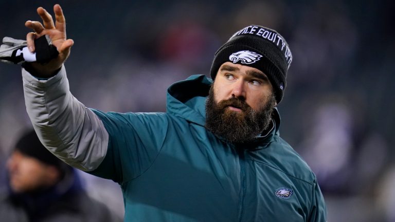 Philadelphia Eagles center Jason Kelce waves to fans as he walks off the field after an NFL football game against the Dallas Cowboys, Saturday, Jan. 8, 2022, in Philadelphia. (AP Photo/Julio Cortez)