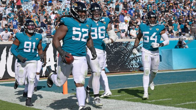 Jacksonville Jaguars defensive tackle DaVon Hamilton celebrates with teammates after recovering an Indianapolis Colts fumble. (Phelan M. Ebenhack/AP)