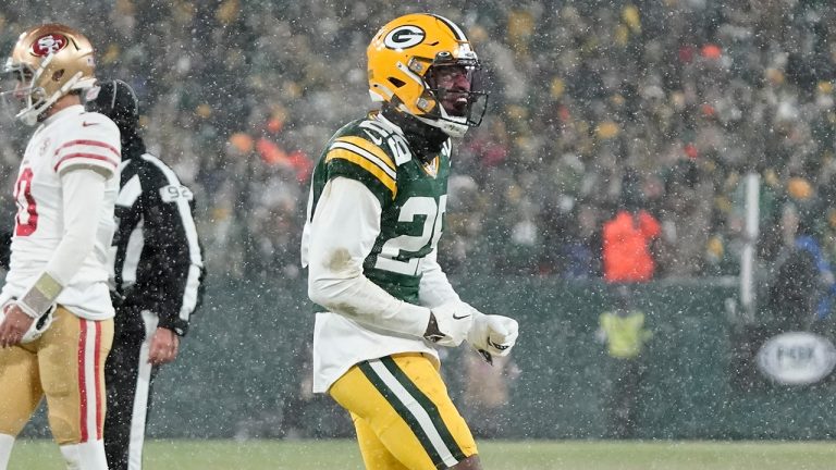 Green Bay Packers' Rasul Douglas reacts in front of San Francisco 49ers' Jimmy Garoppolo after a fourth down stop during the second half of an NFC divisional playoff NFL football game Saturday, Jan. 22, 2022, in Green Bay, Wis. (Morry Gash/AP)