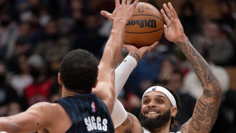 Toronto Raptors guard Gary Trent Jr. (33) shoots against Orlando Magic guard Jalen Suggs (4) during second half NBA action in Toronto on Friday March 4, 2022. (CP)