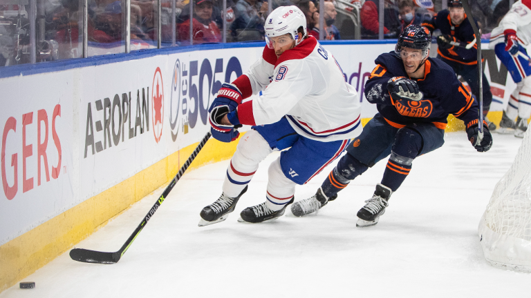 Montreal Canadiens' Ben Chiarot (8) and Edmonton Oilers' Derek Ryan (10) battle for the puck during second period NHL action in Edmonton on Saturday, March 5, 2022. (CP)