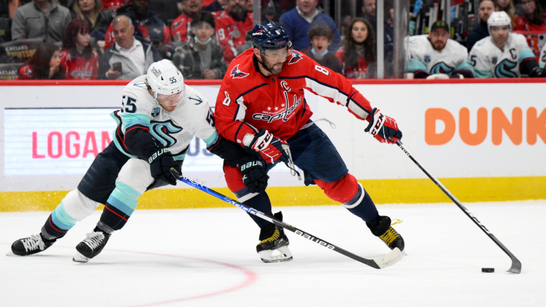 Washington Capitals left wing Alex Ovechkin (8) skates with the puck against Seattle Kraken defenseman Jeremy Lauzon (55) during the first period of an NHL hockey game, Saturday, March 5, 2022, in Washington. (AP)