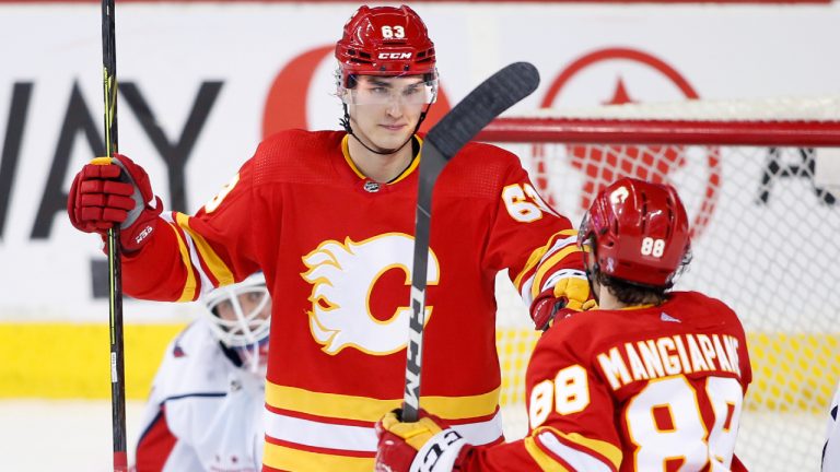 Calgary Flames' Adam Ruzicka, from Slovakia, celebrates with Andrew Mangiapane after his goal against the Washington Capitals. (Larry MacDougal/CP)