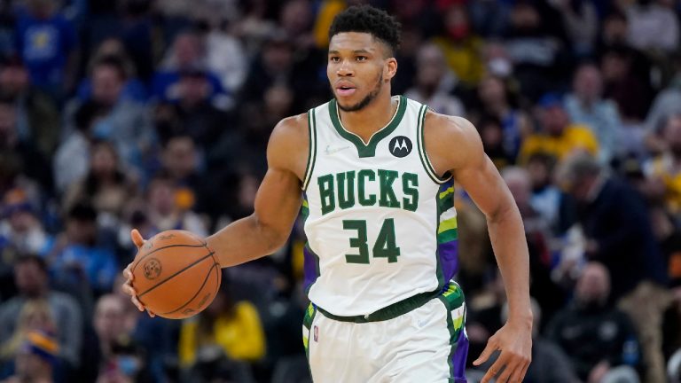 Milwaukee Bucks forward Giannis Antetokounmpo (34) dribbles upcourt during an NBA basketball game. (Jeff Chiu/AP)