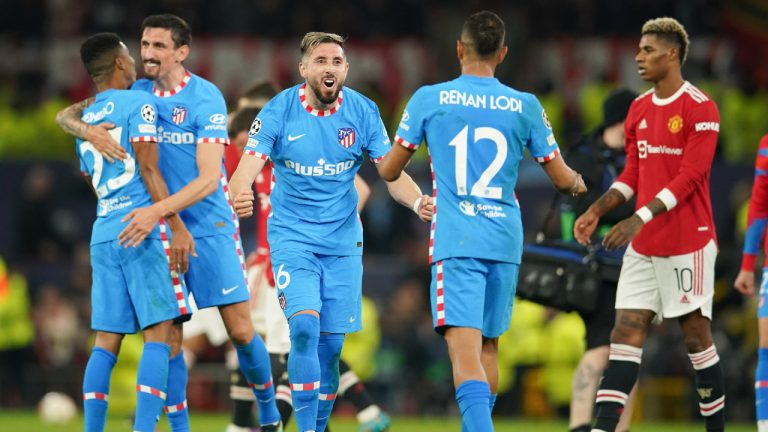 Atletico Madrid's Hector Herrera celebrates with teammate Renan Lodi,  following the Champions League round of 16, second leg against Manchester United. (Dave Thompson/AP)