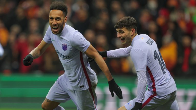 Barcelona's Pierre-Emerick Aubameyang, left, celebrates with teammate Pedri after scoring his side's second goal during the Europa League round of 16 second leg soccer match between Galatasaray and Barcelona in Istanbul, Turkey, Thursday, March 17, 2022. (AP Photo)