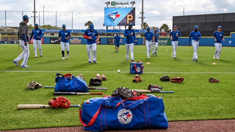 Toronto Blue Jays players loosen up before a spring training baseball game against the Pittsburgh Pirates at TD Ballpark, Sunday, March 20, 2022, in Dunedin, Fla. THE CANADIAN PRESS/Steve Nesius