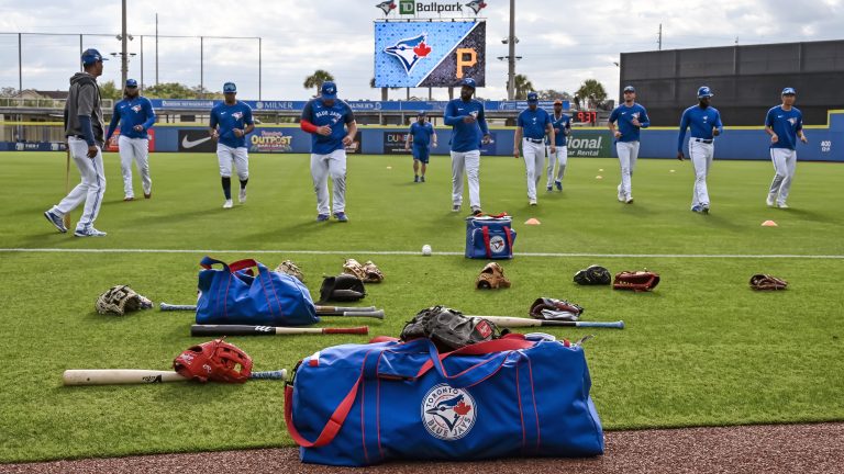 Toronto Blue Jays players loosen up before a spring training baseball game against the Pittsburgh Pirates at TD Ballpark, Sunday, March 20, 2022, in Dunedin, Fla. THE CANADIAN PRESS/Steve Nesius