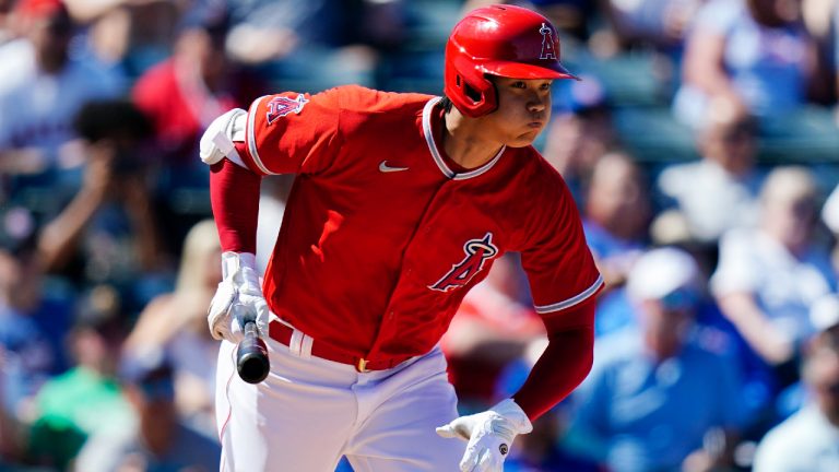 Los Angeles Angels' Shohei Ohtani, runs out an infield grounder during the third inning of the team's spring training baseball game against the Chicago Cubs. (Ross D. Franklin/AP)