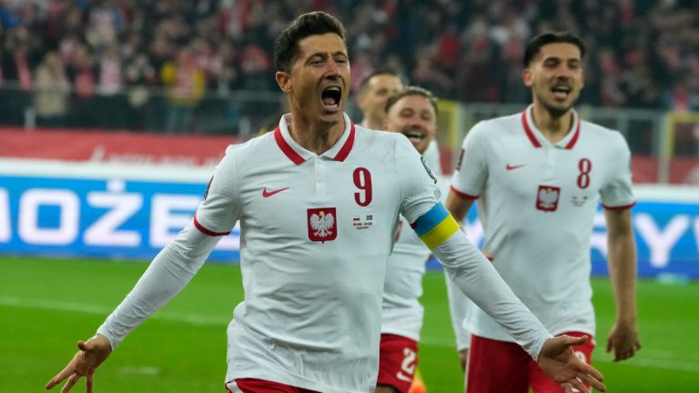 Poland's Robert Lewandowski celebrates after scoring the opening goal of his team during the World Cup 2022 playoff soccer match between Poland and Sweden. (Czarek Sokolowski/AP)