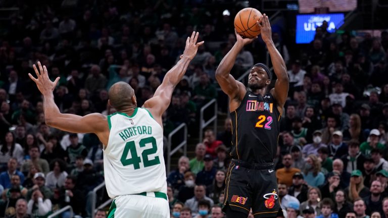 Miami Heat forward Jimmy Butler (22) shoots over Boston Celtics center Al Horford (42) during the second half of an NBA basketball game Wednesday, March 30, 2022, in Boston. (AP Photo/Charles Krupa)