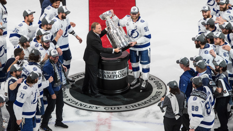 Tampa Bay Lightning's Steven Stamkos (91) is presented the Stanley Cup from NHL commissioner Gary Bettman as they celebrate after defeating the Dallas Stars in Edmonton on Monday, September 28, 2020. (CP)