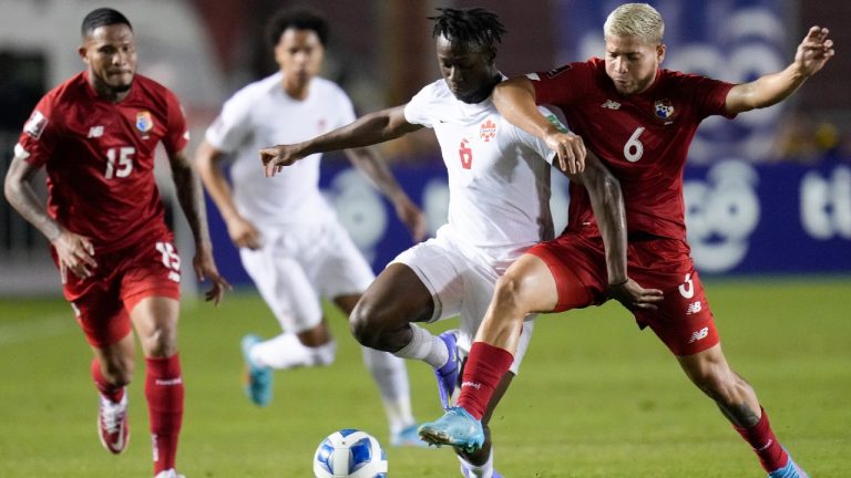 Panama's Cristian Martinez, right, and Canada's Ismael Kone (6) battle for the ball during a qualifying soccer match for the FIFA World Cup Qatar 2022 in Panama City, Panama, Wednesday, March 30, 2022. (Arnulfo Franco/AP)