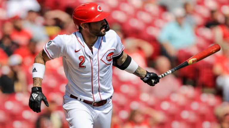 Cincinnati Reds' Nick Castellanos watches as he hits a sacrifice fly during the first inning of a baseball game against the Pittsburgh Pirates in Cincinnati, Monday, Sept. 27, 2021. (Aaron Doster/AP)