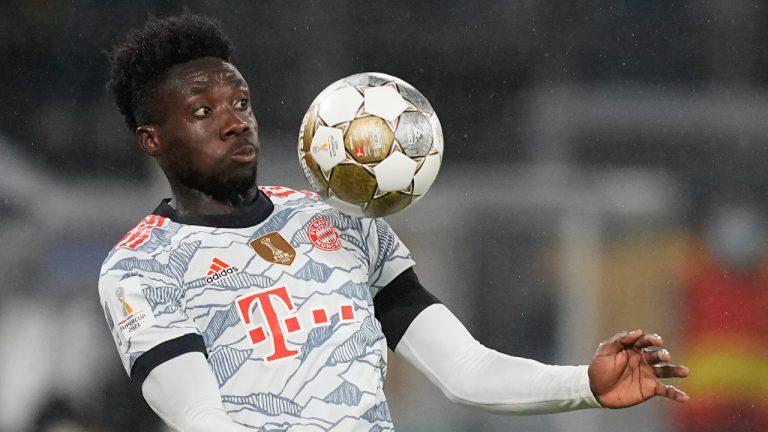 Bayern's Alphonso Davies controls the ball in the air during the German Supercup soccer match between Borussia Dortmund and Bayern Munich in Dortmund, Germany, Tuesday, Aug. 17, 2021. (Martin Meissner/AP)