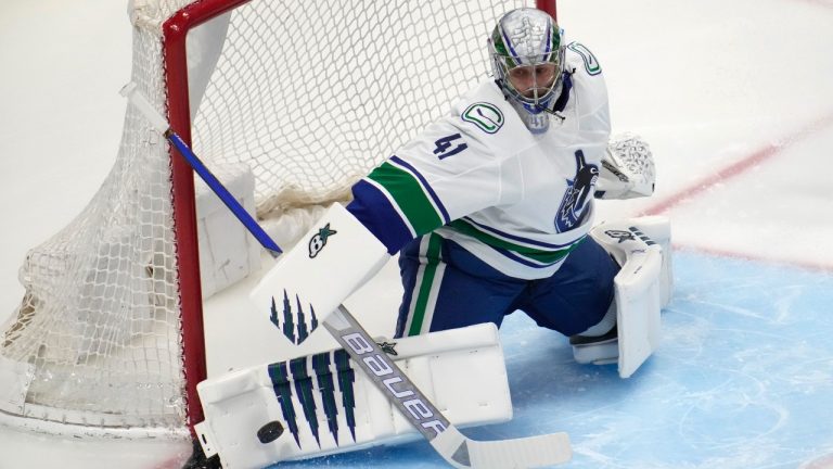 Vancouver Canucks goaltender Jaroslav Halak makes a pad save against the Colorado Avalanche during the first period of an NHL hockey game Wednesday, March 23, 2022, in Denver. (David Zalubowski/AP)