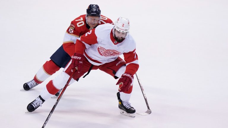 Detroit Red Wings defenseman Nick Leddy (2) and Florida Panthers right wing Patric Hornqvist (70) battle for the puck during the first period of an NHL hockey game, Saturday, March 5, 2022, in Sunrise, Fla. (Wilfredo Lee/AP)