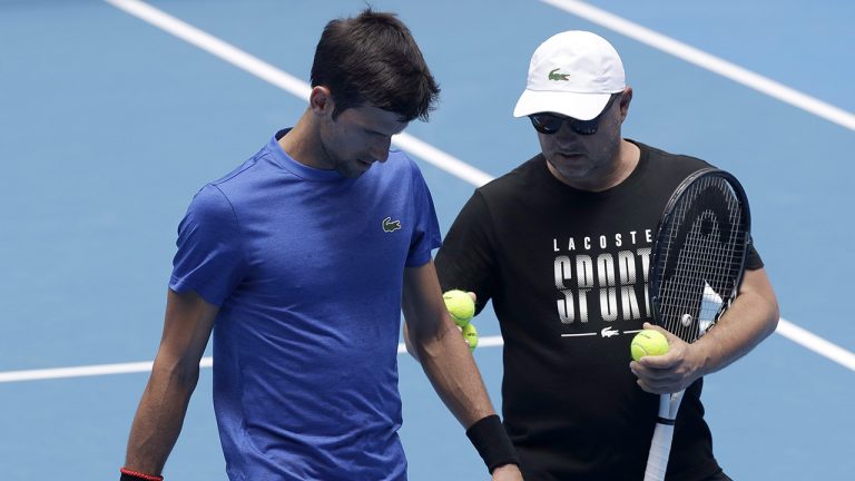 Serbia's Novak Djokovic talks with his coach Marian Vajda during a practice session ahead of the Australian Open tennis championships. (Kin Cheung/AP)