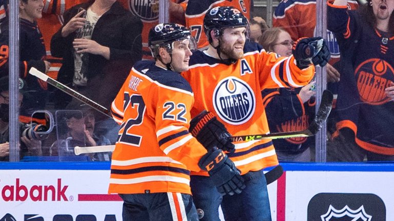 Edmonton Oilers' Tyson Barrie (22) and Leon Draisaitl (29) celebrate a goal against the Los Angeles Kings during first period NHL action in Edmonton on Wednesday, March 30, 2022. (Jason Franson/CP)