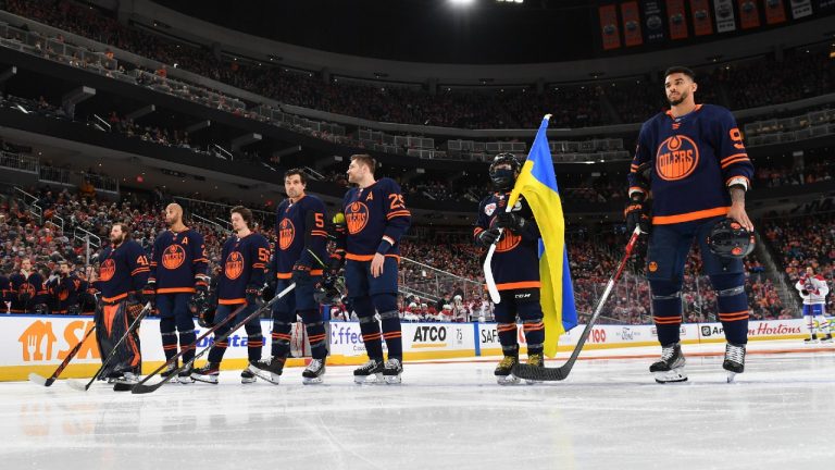 Edmonton Oilers players, from left to right, Mike Smith, Darnell Nurse, Kailer Yamamoto, Cody Ceci, Leon Draisaitl and Evander Kane stand for the singing of the national anthem prior to the game against the Montreal Canadiens. (Andy Devlin/NHLI via Getty Images)