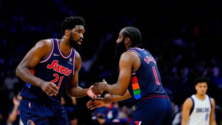 Philadelphia 76ers' Joel Embiid, left, and James Harden celebrate during the first half of an NBA basketball gameÂ against the Dallas Mavericks, Friday, March 18, 2022, in Philadelphia. (Matt Slocum/AP Photo)