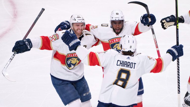 Florida Panthers' Anthony Duclair, right, celebrates his goal against the Montreal Canadiens with teammates Jonathan Huberdeau, left, and Ben Chiarot during second period NHL hockey action in Montreal on Thursday, March 24, 2022. (Paul Chiasson/CP)