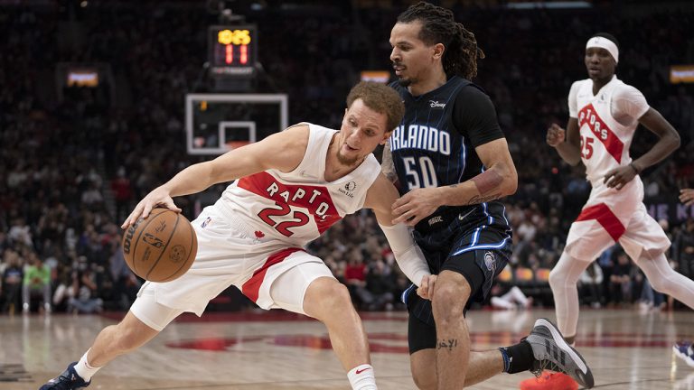 Toronto Raptors guard Malachi Flynn (22) runs into stiff defence from Orlando Magic guard Cole Anthony (50) during second half NBA action in Toronto on Friday March 4, 2022. (Frank Gunn/CP)