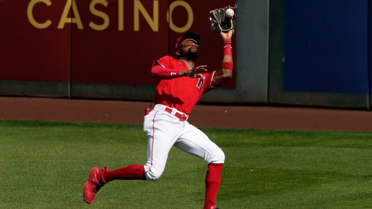 Dexter Fowler, pictured as a member of the Angels, catches a fly out hit by Texas Rangers' Jonah Heim during the second inning of a spring training baseball game, Wednesday, March 3, 2021, in Tempe Ariz. (Matt York/AP Photo)