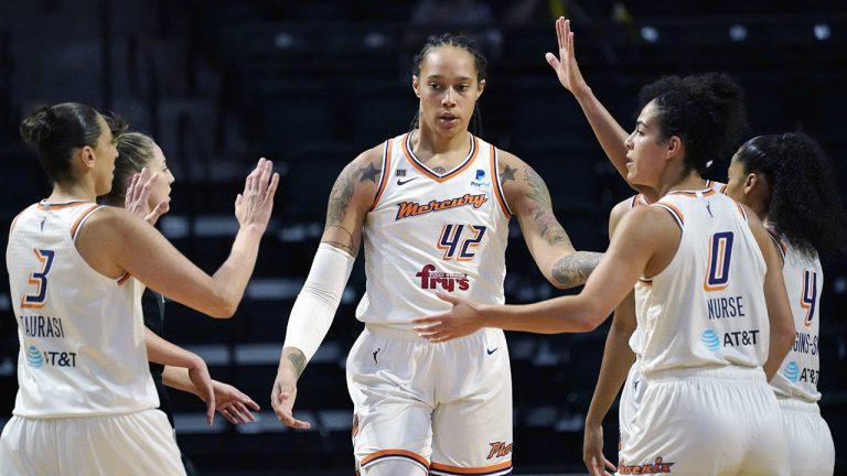 Phoenix Mercury's Brittney Griner (42) is congratulated on a play against the Seattle Storm in the first half of the second round of the WNBA basketball playoffs. (Elaine Thompson/AP)