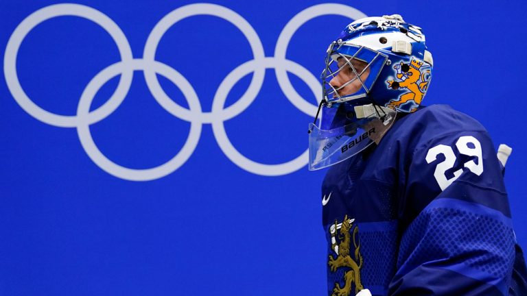 Finland goalkeeper Harri Sateri walks to the ice for the men's gold medal hockey game between Finland and Russian Olympic Committee at the 2022 Winter Olympics. (Matt Slocum/AP)