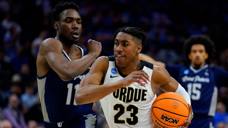 Purdue's Jaden Ivey (23) drives past Saint Peter's KC Ndefo (11) during the second half of a college basketball game in the Sweet 16 round of the NCAA tournament. (Matt Rourke/AP)