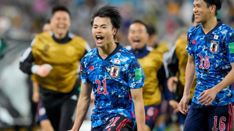 Japan's Kaoru Mitoma celebrates after scoring his team's second goal during the World Cup 2022 play-off soccer match between Japan and Australia at Stadium Australia in Sydney, Thursday, March 24, 2022. (Mark Baker/AP)