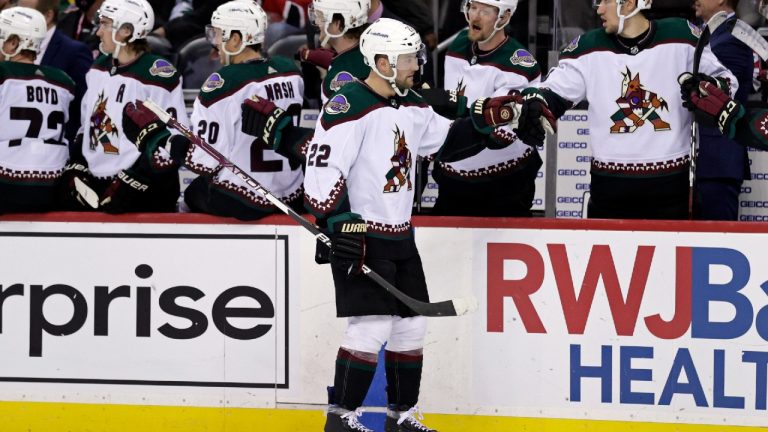 Arizona Coyotes left wing Johan Larsson (22) celebrates with teammates after scoring a goal during the third period of an NHL hockey game against the New Jersey Devils on Wednesday, Jan. 19, 2022, in Newark, N.J. The Coyotes won 4-1. (Adam Hunger/AP)