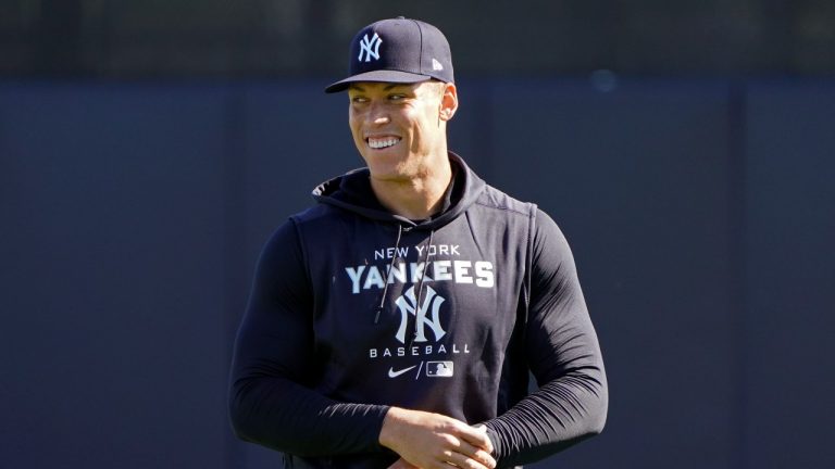 New York Yankees outfielder Aaron Judge shares a laugh with teammates during a spring training baseball workout, Monday, March 14, 2022, in Tampa, Fla. (John Raoux/AP Photo)