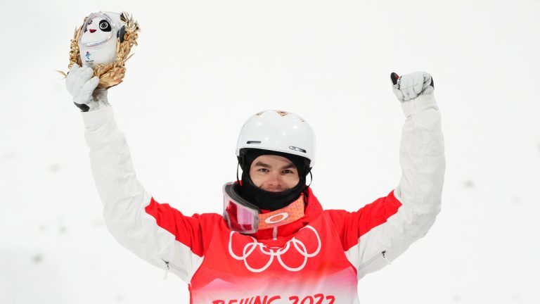 Mikael Kingsbury, of Canada, stands on the podium after men's moguls finals at the 2022 Winter Olympics in Zhangjiakou, China on Saturday, February 5, 2022. Kingsbury took home the silver medal. (Sean Kilpatrick/CP)