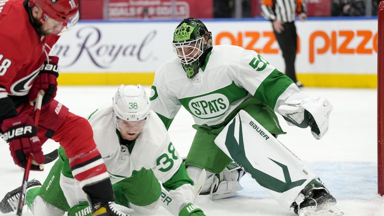 Toronto Maple Leafs goaltender Erik Kallgren (50) looks on as teammate Rasmus Sandin (38) scrambles to block an attempt by Carolina Hurricanes centre Derek Stepan (18) during first period NHL hockey action in Toronto, Thursday, March 17, 2022. THE CANADIAN PRESS/Frank Gunn