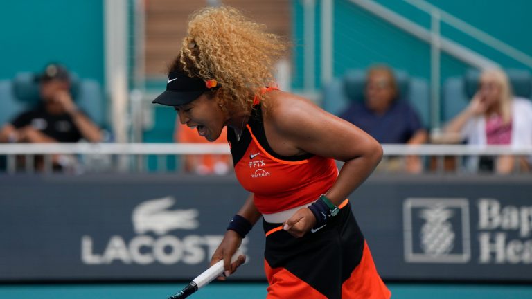 Naomi Osaka, of Japan, reacts as she wins her second round women's match against Angelique Kerber, of Germany, at the Miami Open tennis tournament, Thursday, March 24, 2022, in Miami Gardens, Fla. (Rebecca Blackwell/AP)