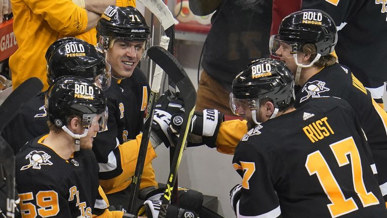 Pittsburgh Penguins' Evgeni Malkin (71) celebrates after scoring his third goal of the NHL hockey game against the Detroit Red Wings. (Gene J. Puskar/AP)