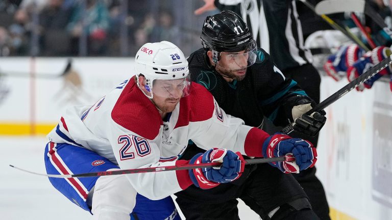 Montreal Canadiens defenceman Jeff Petry (26) and San Jose Sharks center Andrew Cogliano (11) vie for the puck during the first period of an NHL hockey game Thursday, Oct. 28, 2021, in San Jose, Calif. (Tony Avelar/AP)