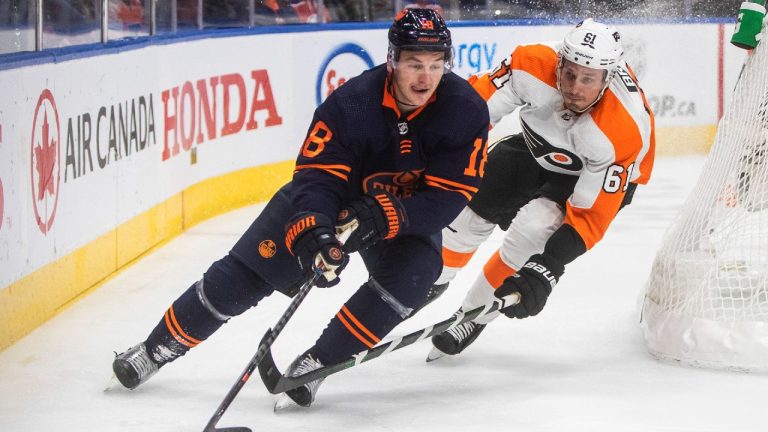 Philadelphia Flyers' Justin Braun (61) chases Edmonton Oilers' Zach Hyman (18) during second period NHL action in Edmonton on Wednesday, October 27, 2021. (Jason Franson/CP)