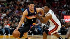 Booker returns, helps Suns clinch playoff spot with win over Heat