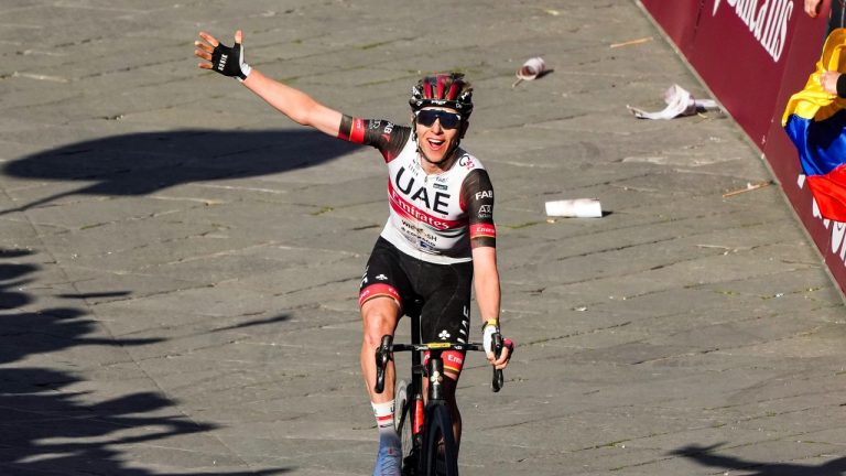 Slovenia's Tadej Pogacar celebrates winning of the Strade Bianche (White Roads) cycling race, in Siena, Italy, Saturday, March 5, 2022. (Gian Mattia D'Alberto/LaPresse via AP)