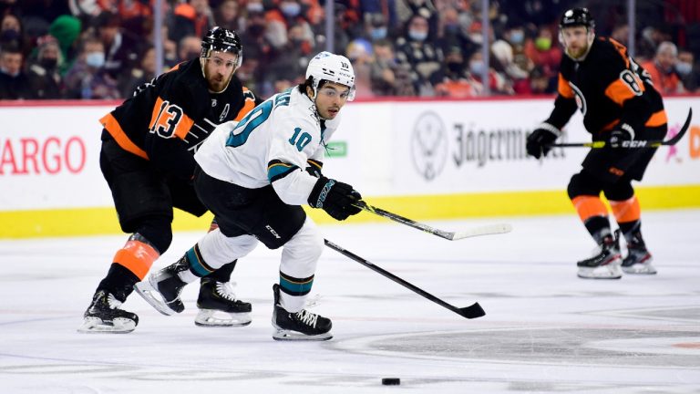 San Jose Sharks' Nick Merkley passes the puck as he is pressured by Philadelphia Flyers' Kevin Hayes, left, during the second period of an NHL hockey game, Saturday, Jan. 8, 2022, in Philadelphia. (Derik Hamilton/AP)