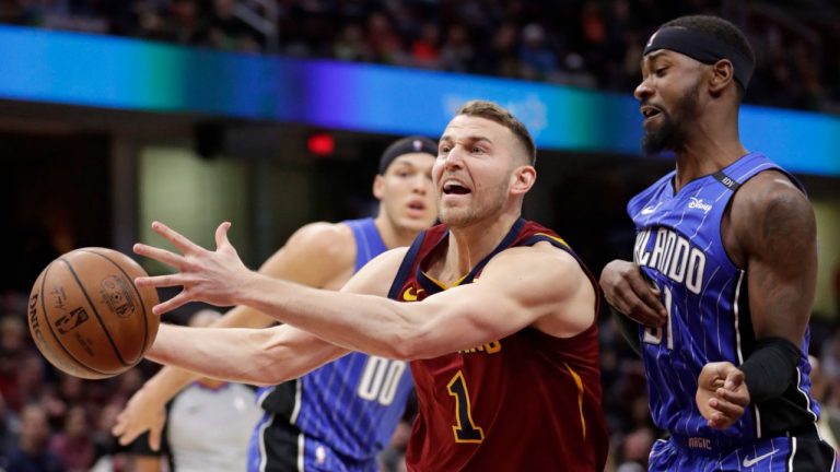 Cleveland Cavaliers' Nik Stauskas, front left, loses control of the ball against Orlando Magic's Terrence Ross in the first half of an NBA basketball game, Sunday, March 3, 2019, in Cleveland. (Tony Dejak/AP Photo)