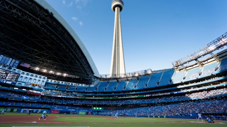 Toronto Blue Jays starting pitcher Ross Stripling (48) throws the opening pitch of the Toronto Blue Jays first home game of the 2021 season at the Rogers Centre in Toronto against the Kansas City Royals during MLB action on Friday, July 30, 2021. (Peter Power/CP)