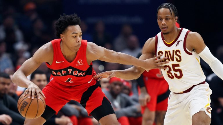 Toronto Raptors' Scottie Barnes (4) works against Cleveland Cavaliers' Isaac Okoro (35) during the first half of an NBA basketball game, Sunday, March 6, 2022, in Cleveland. (Ron Schwane/AP)