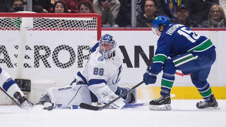 Tampa Bay Lightning goalie Andrei Vasilevskiy (88), of Russia, stops Vancouver Canucks' Matthew Highmore (15) during the first period of an NHL hockey game. (Darryl Dyck/CP)